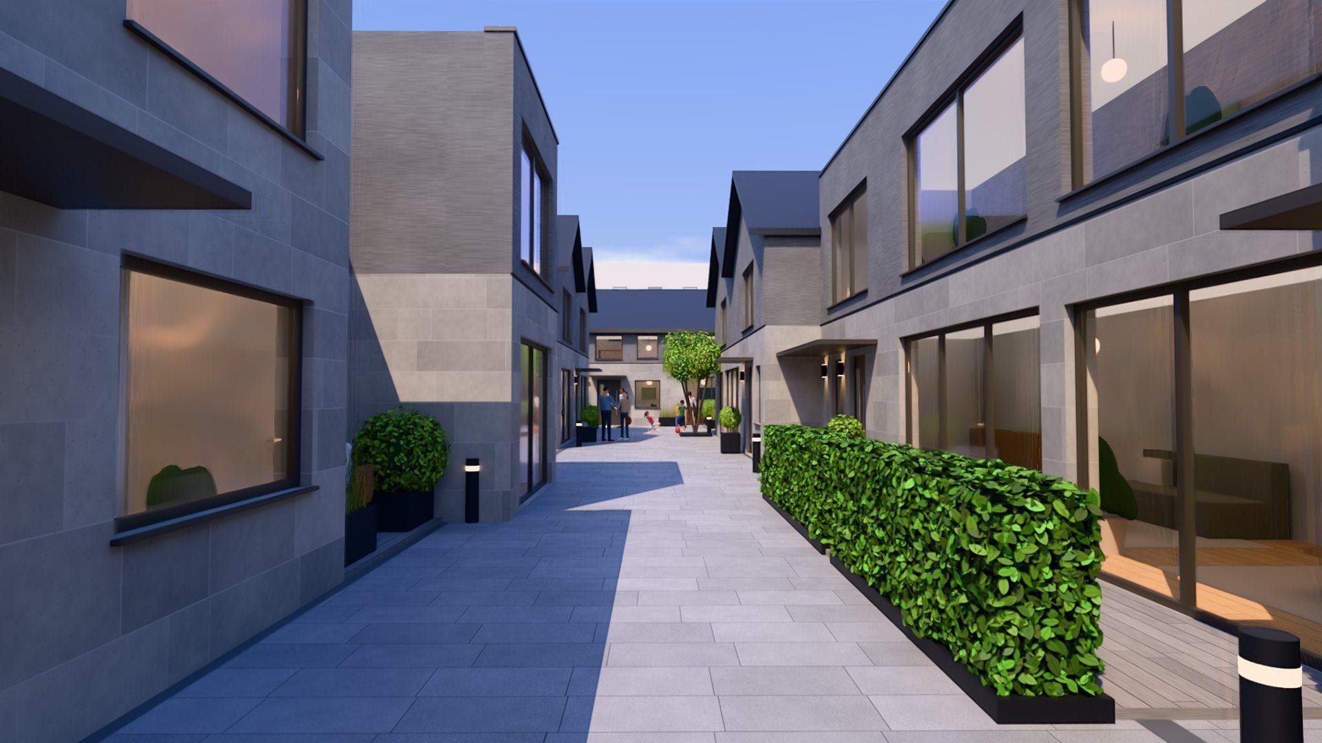 Weg zwischen den neuen Häusern mit Hecke und Hof